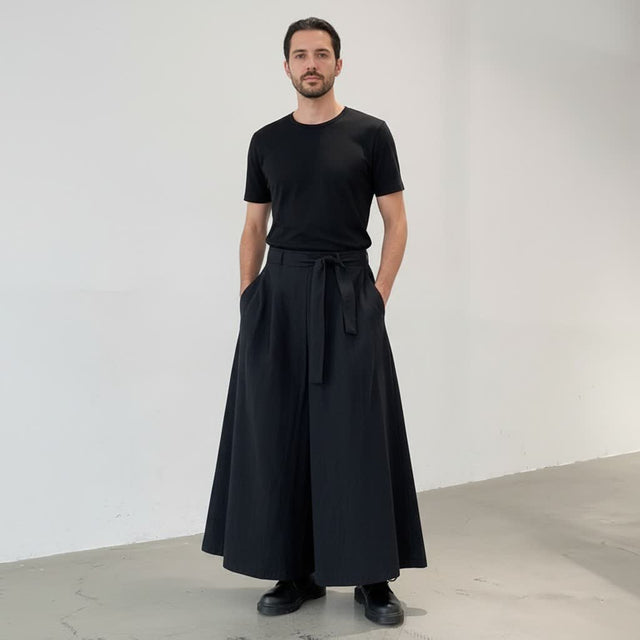 Men's long wide hakama pants, front view: belted front with long ties over a floor-length wide leg