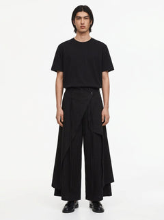Men's Dark Cotton Hakama Pants in black, front view: the wrap panel buttons at the right hip over wide floor-length legs