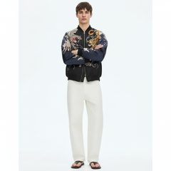 Men's Reversible Phoenix Sukajan Souvenir Jacket on model in navy, front view with phoenix and tiger embroidery