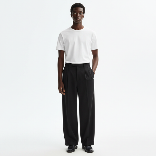 Wide Leg Pleated Suit Trousers on model in black, front view