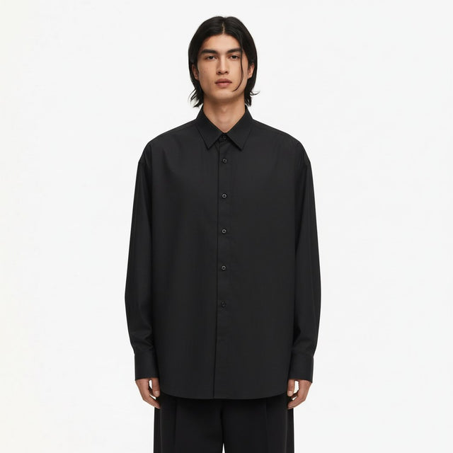 Oversized lyocell button up shirt in black, front view on model