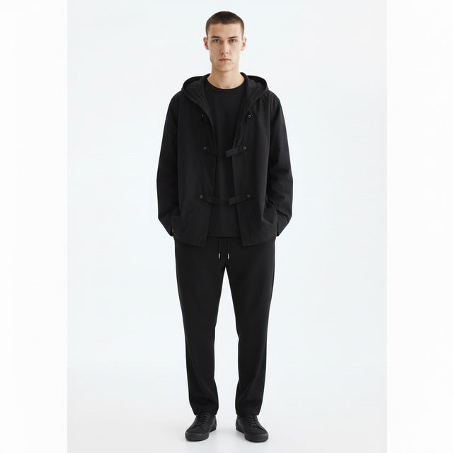Hooded shirt jacket on model in black, front view