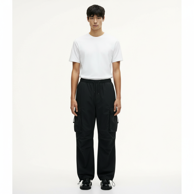 Parachute Cargo Pants on model in black, front view