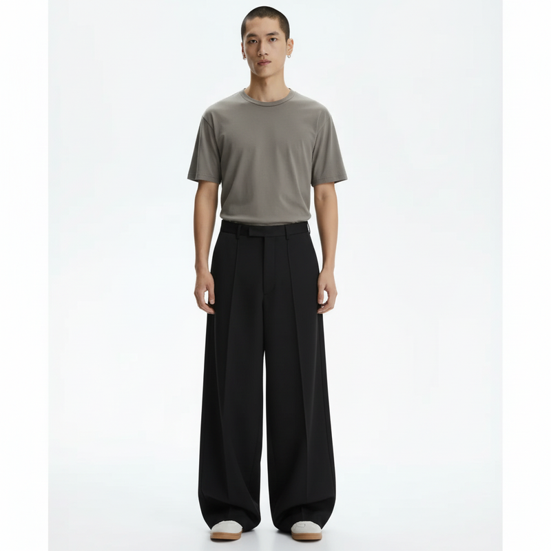 Wide pleated pants on model in black, front view