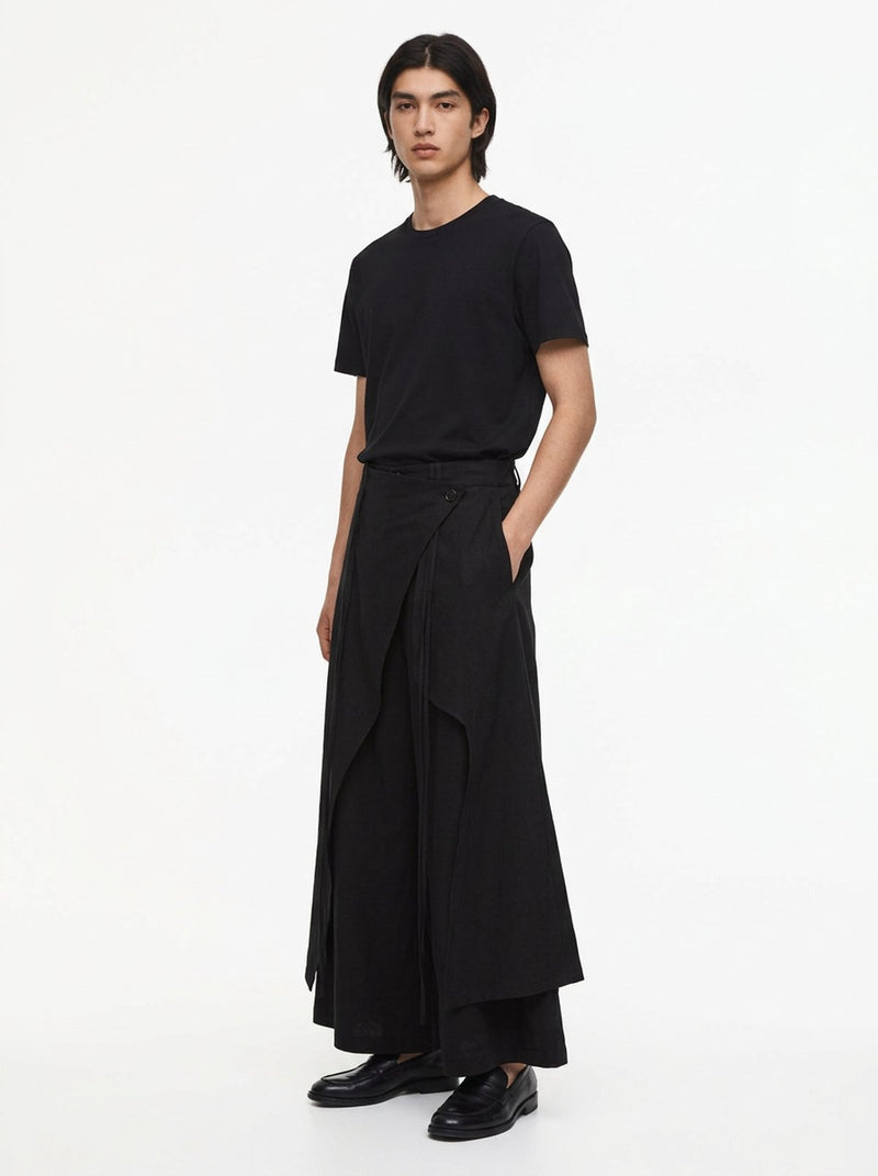 Black cotton hakama pants worn with a black T-shirt and loafers, three-quarter view
