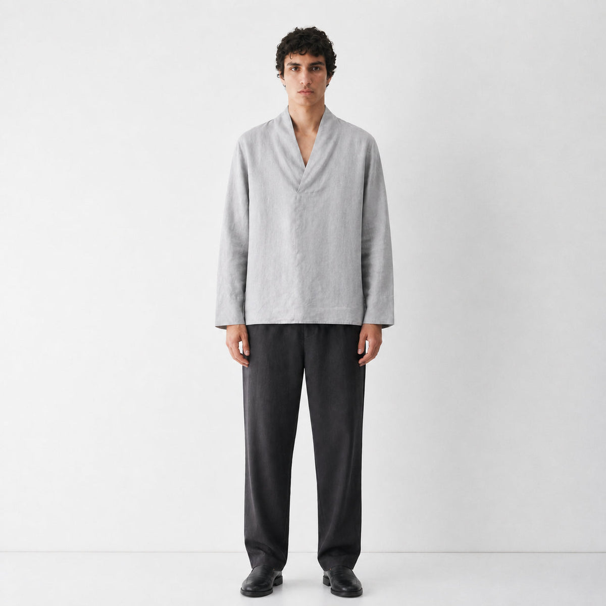 A Shinu sleeve shirt with a soft folded V neckline and boxy body