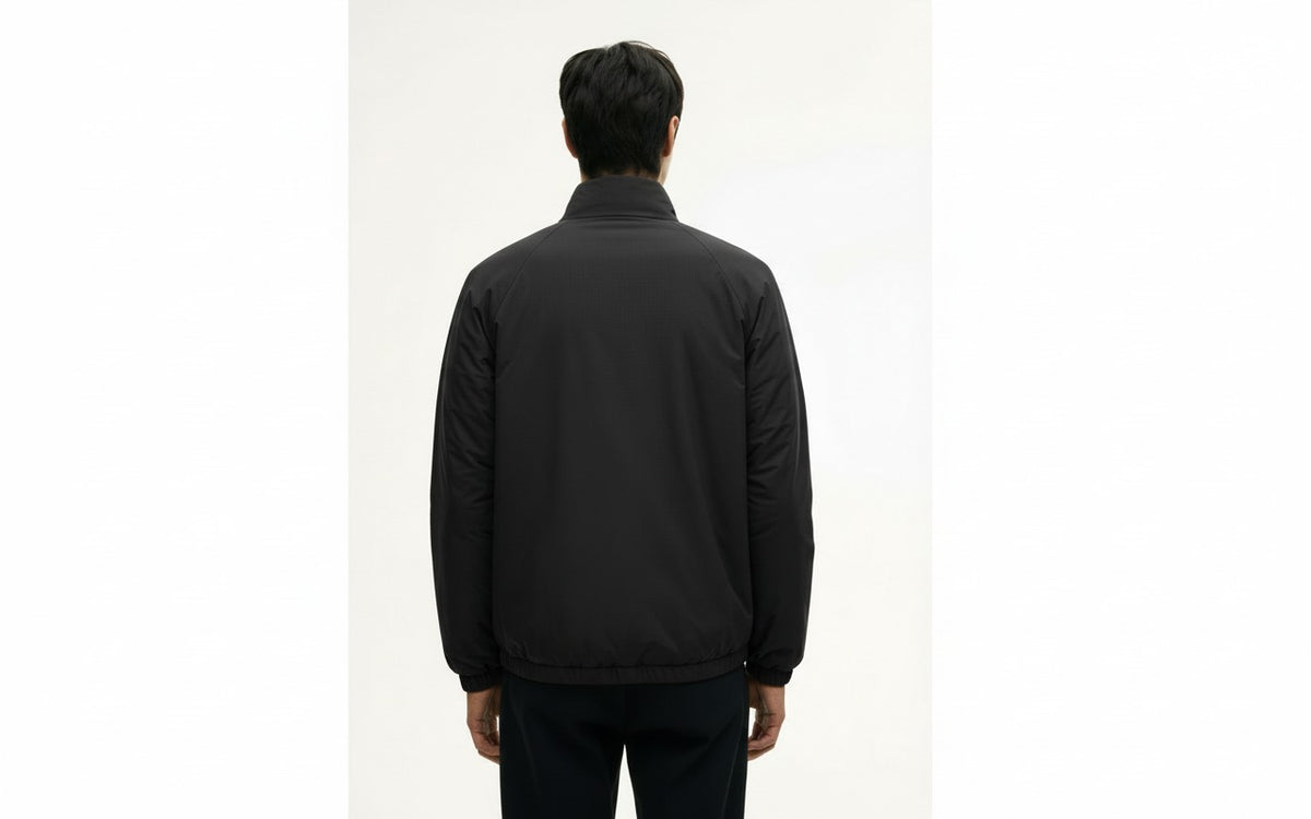Padded hanten jacket in black, back view on model