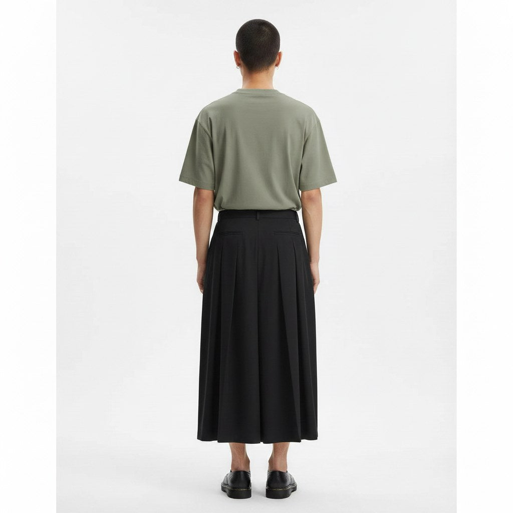 Pleated hakama style pants on model in black, back view