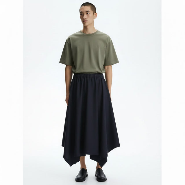 Handkerchief hem harem pants on model in black, front view