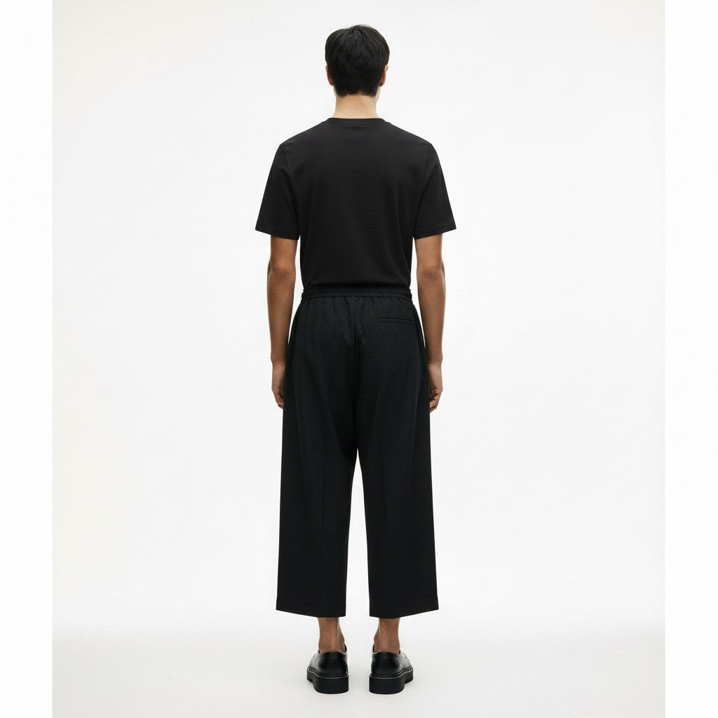 Japanese style drawstring pants on model in black, back view