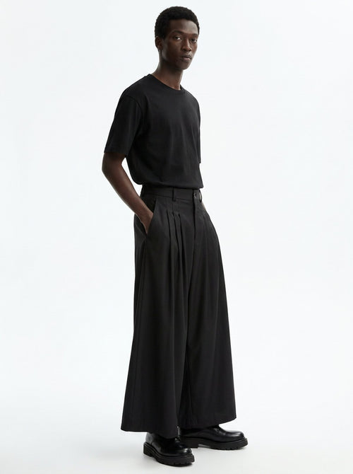 Men's Wide Pleated Japanese Hakama Pants, three-quarter view showing the full volume of the wide leg