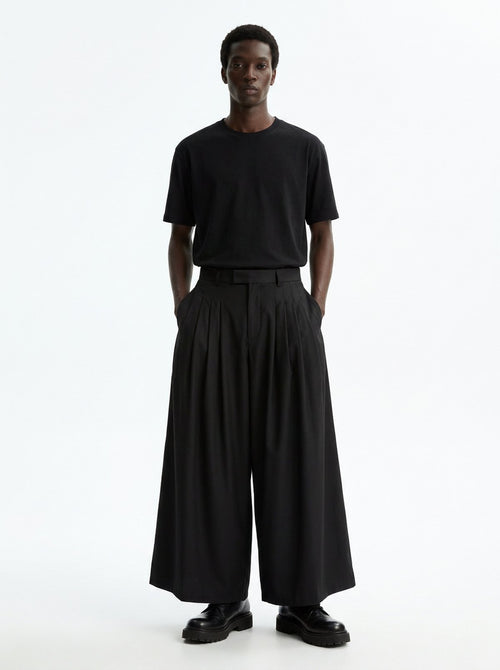 Men's Wide Pleated Japanese Hakama Pants in black, front view: four deep pleats each side and a very wide ankle-length leg