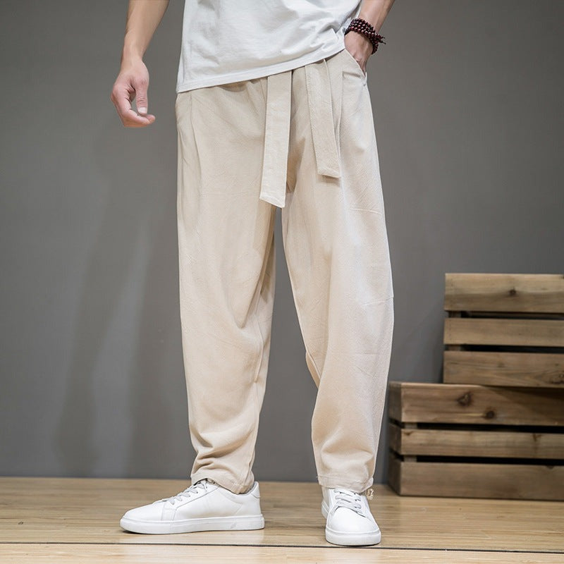 Men's cotton linen pants, loose straight leg, white, on model