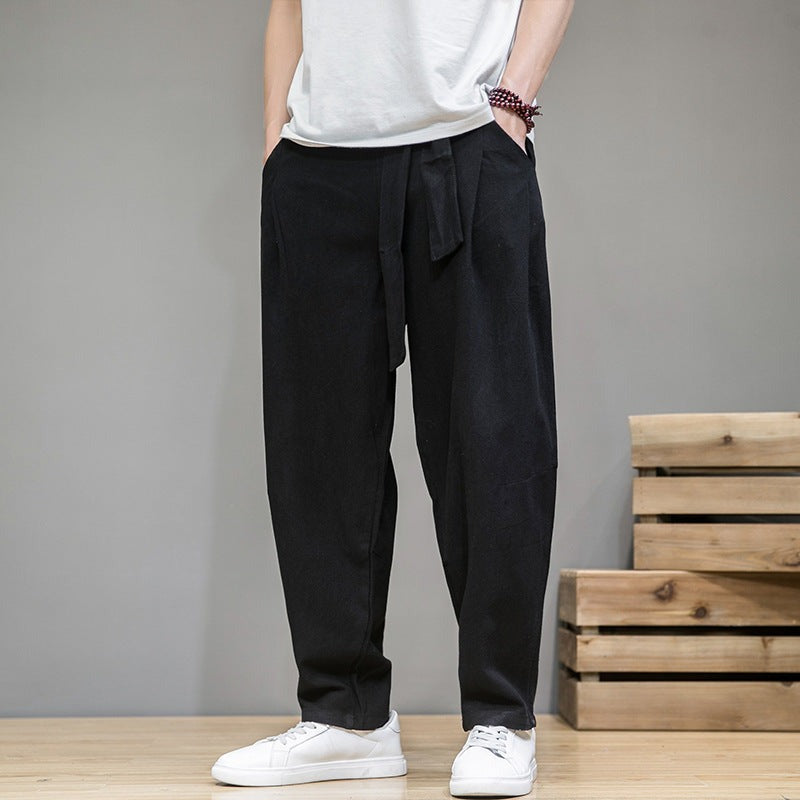 Men's cotton linen pants, loose straight leg, black, on model