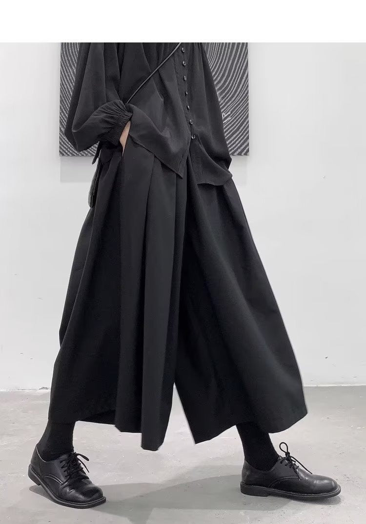 Men's japanese hakama pants, black pleated skirt panel, on model, walking