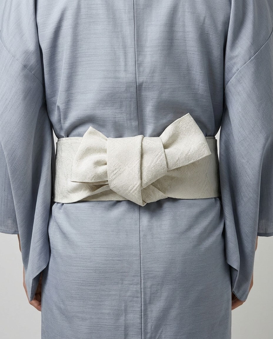 Light blue kimono belt knot and fabric close-up