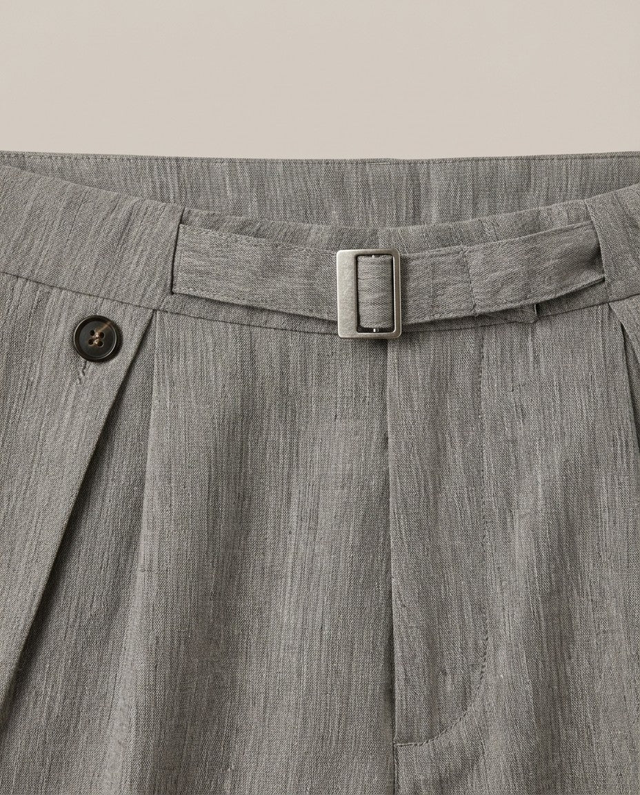 Mens pleated linen pants buckle belt and button pleat close-up