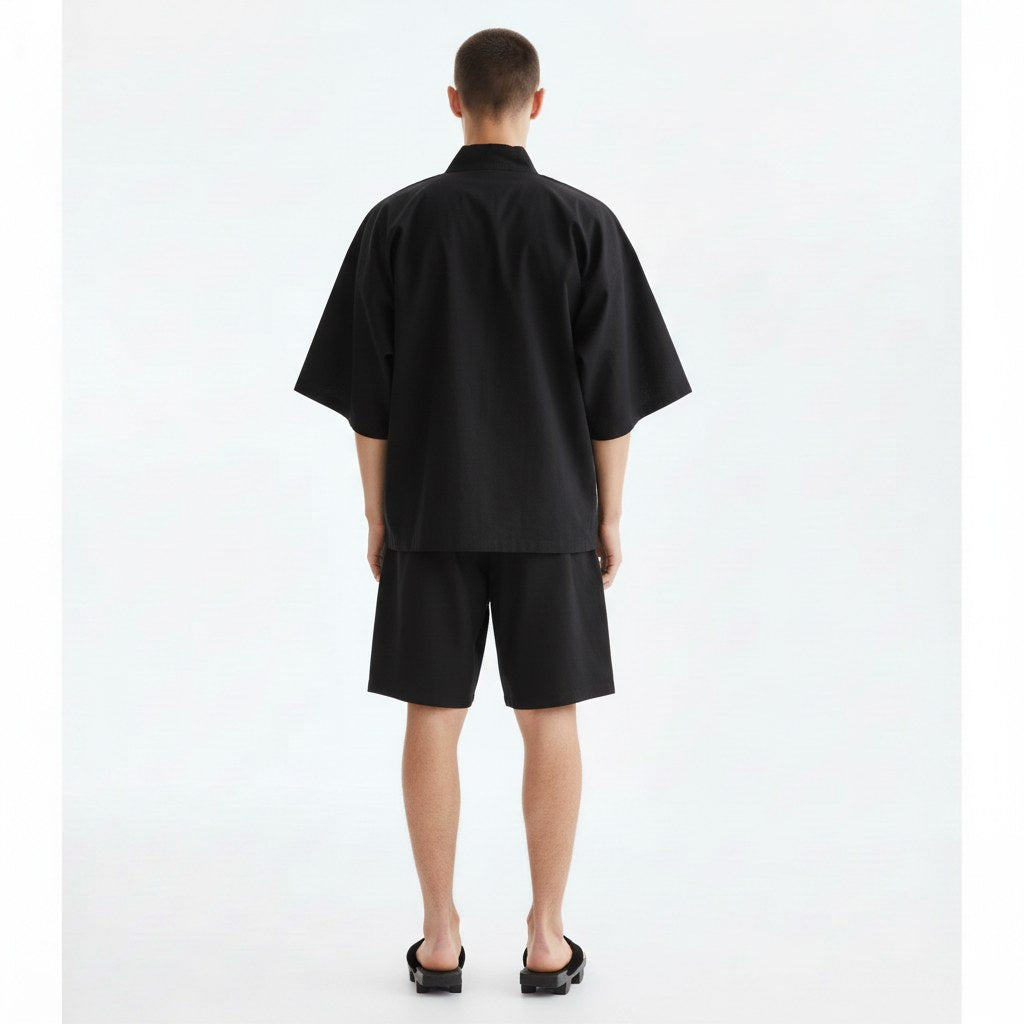 Cotton jinbei set in black, back view on model