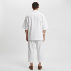 Cross-tie samue set in white, back view on model