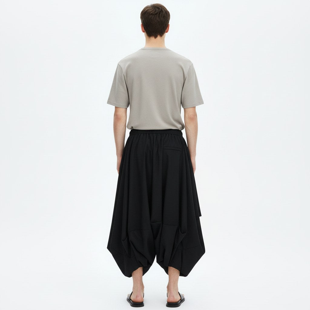 Bubble drape pants on model in black, back view