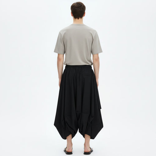 Bubble drape pants on model in black, back view