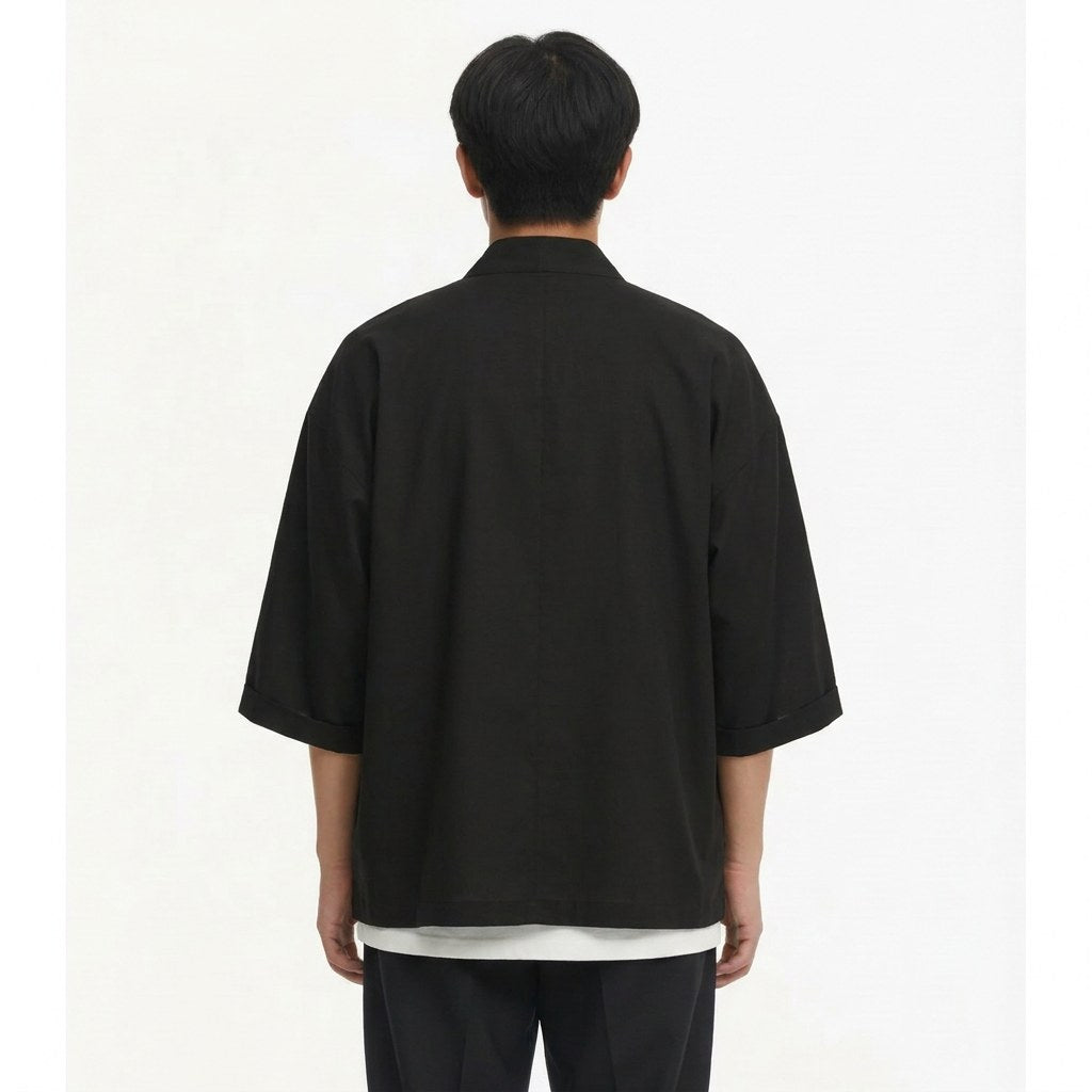 Tied noragi jacket in black, back view on model