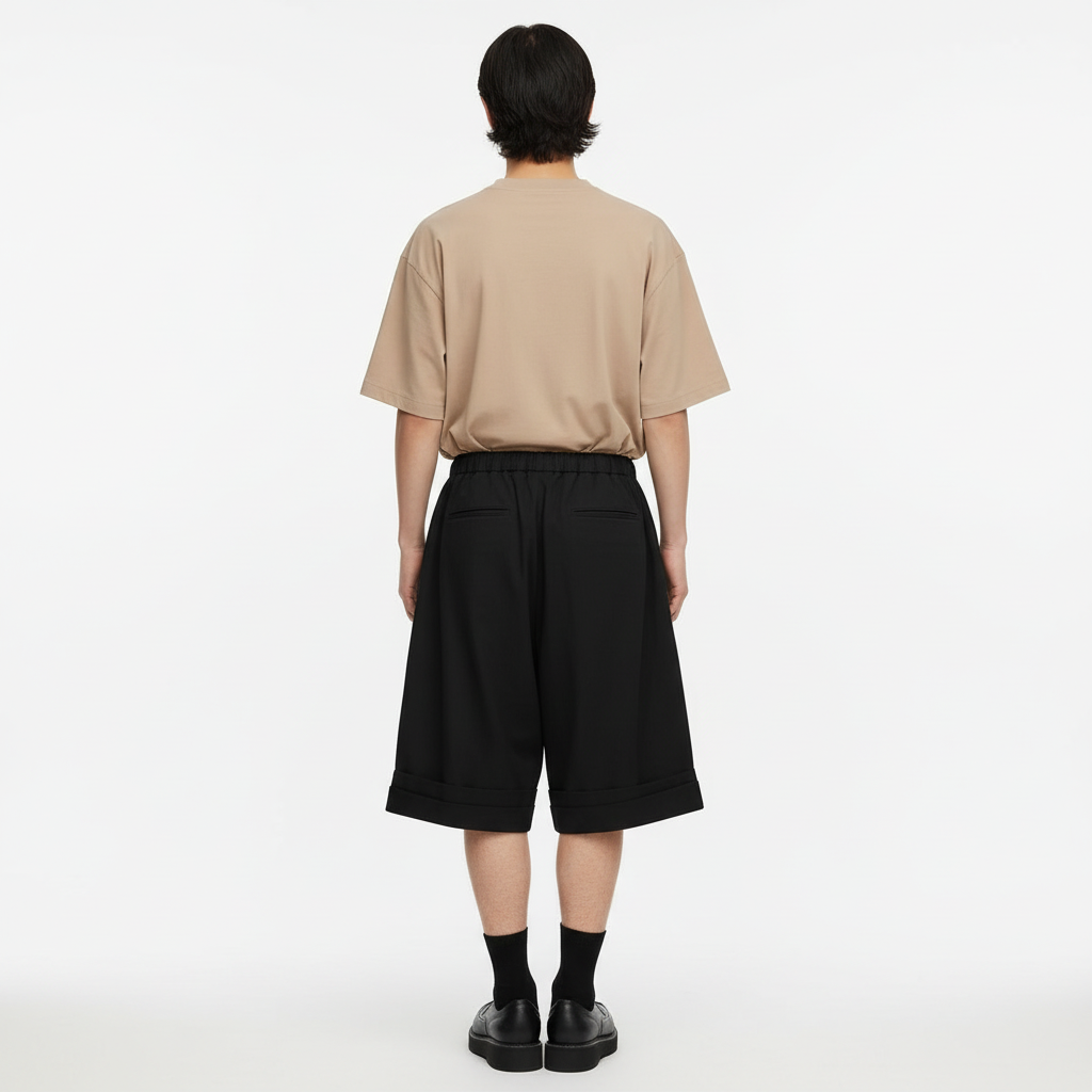 Pleated hakama shorts on model in black, back view