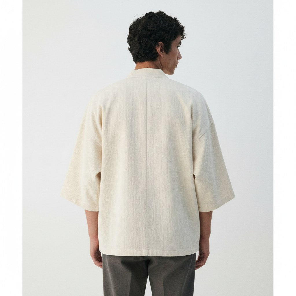 Herringbone noragi jacket in ecru, back view on model