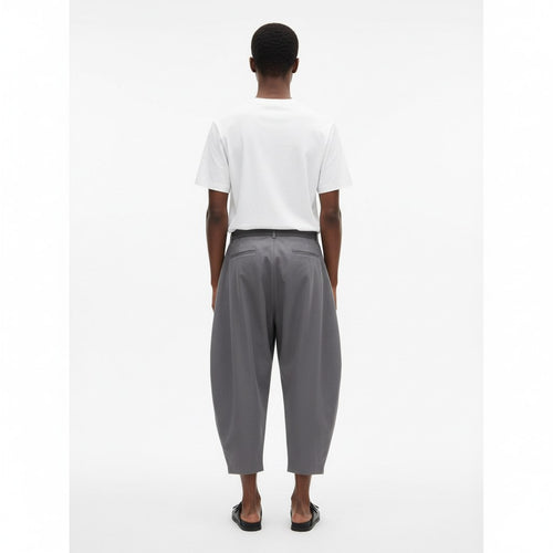 Monpe balloon pants on model in gray, back view