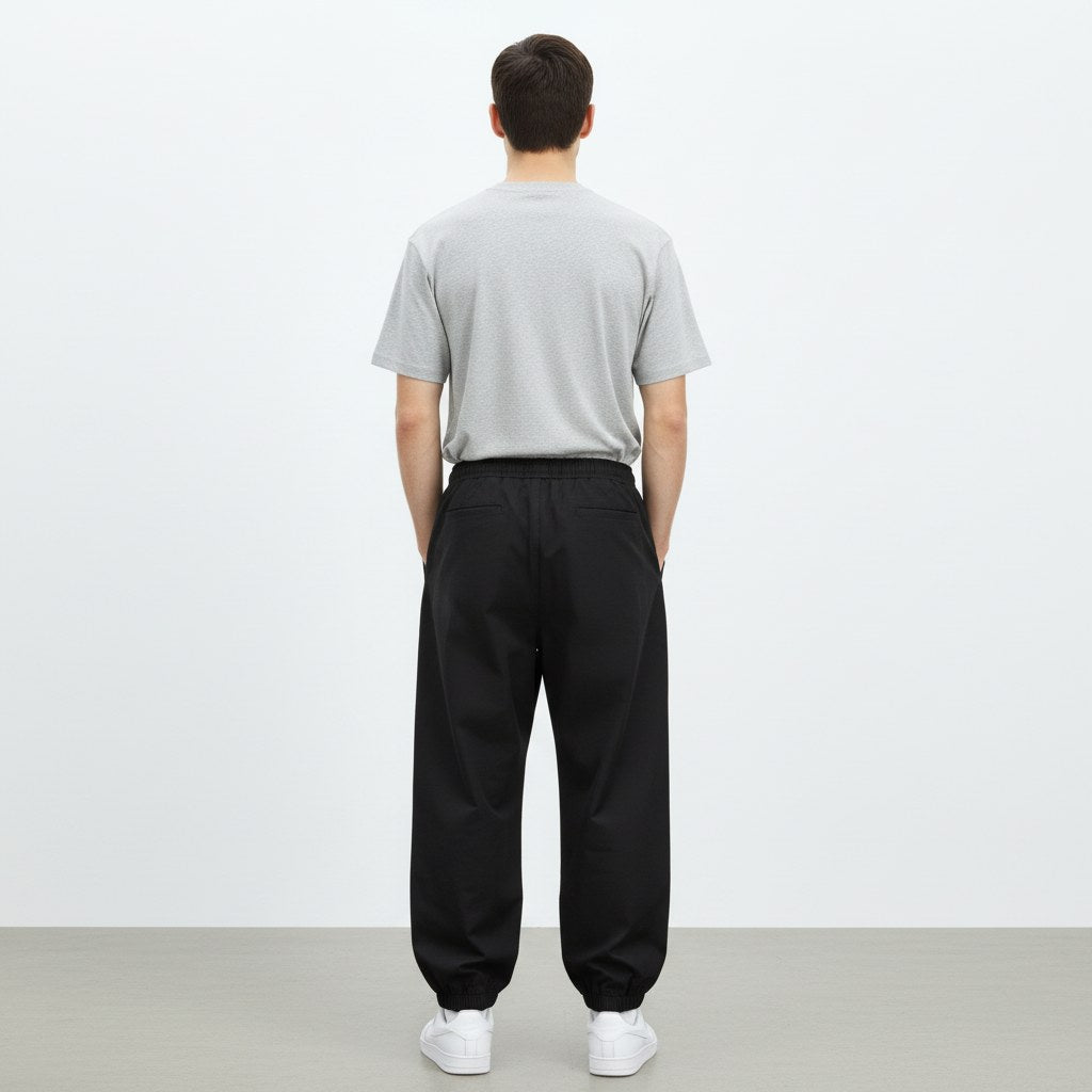 Wide lantern work pants in black, back view on model