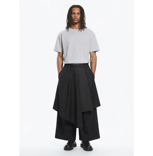 Layered hakama overlay pants in black, front view on model