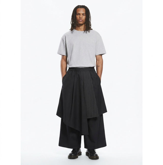 Layered hakama overlay pants in black, front view on model