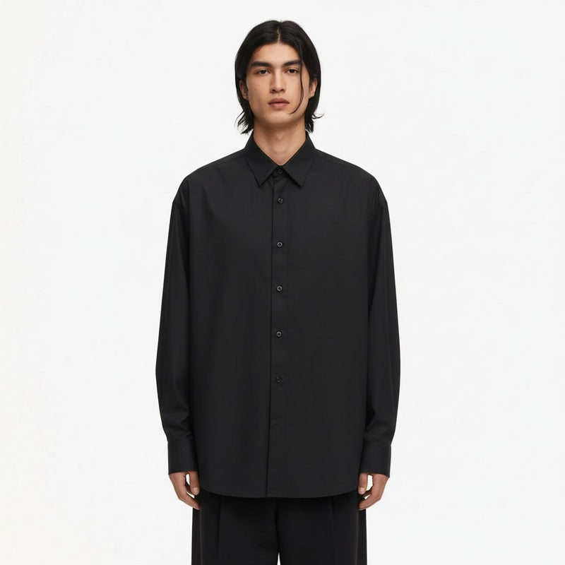 Oversized lyocell button up shirt in black, front view on model