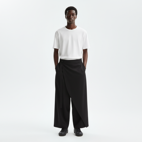 One leg skirt wrap pants on model in black, front view