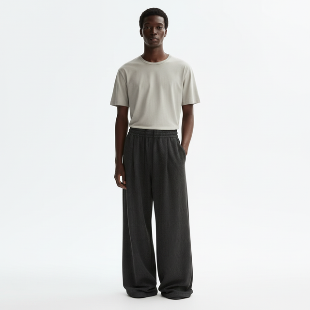 Pleated Wide Leg Sweatpants on model in charcoal black, front view