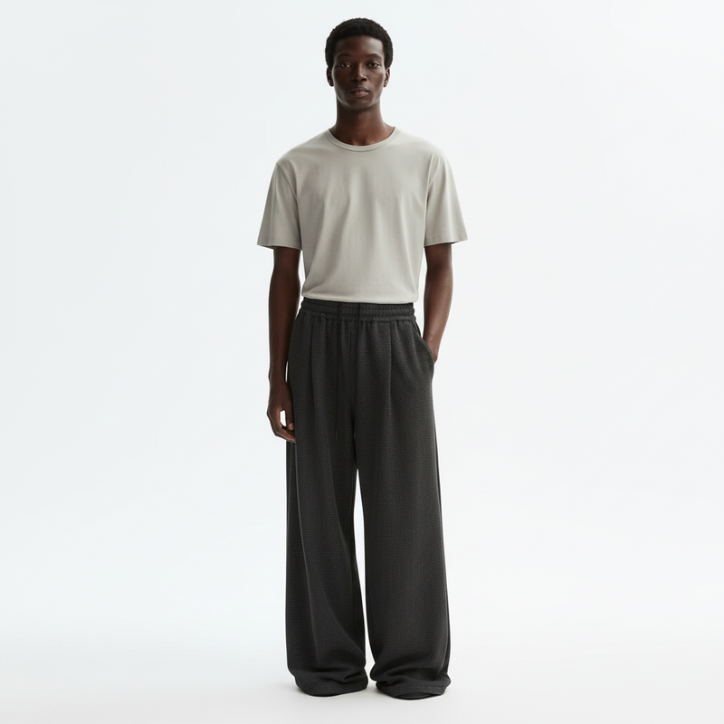 Pleated Wide Leg Sweatpants on model in charcoal black, front view