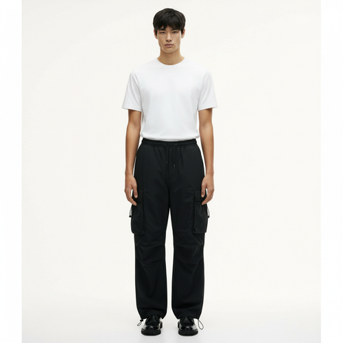 Parachute Cargo Pants on model in black, front view