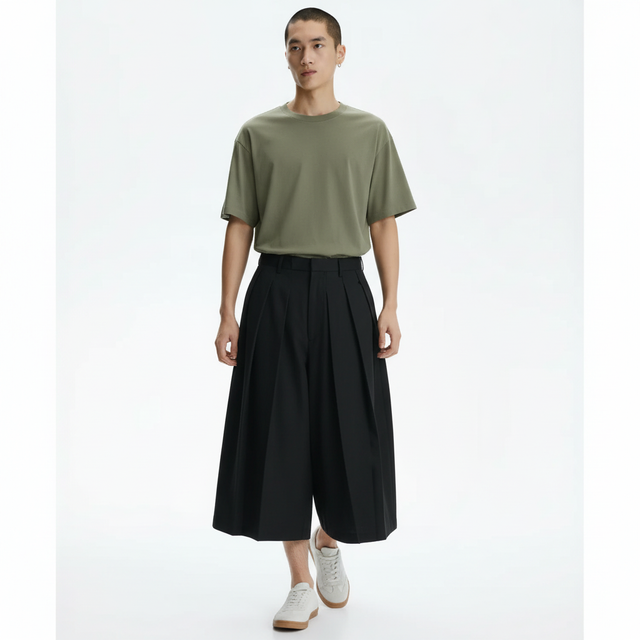 Pleated hakama style pants on model in black, front view