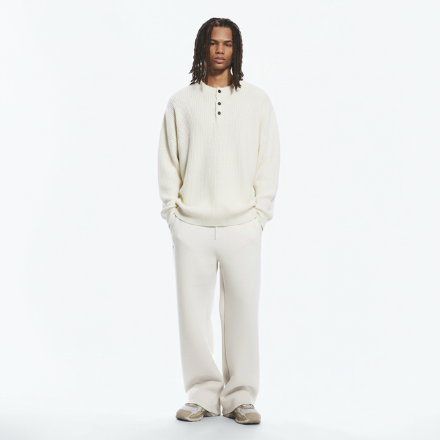 Henley Rib Sweater on model in ivory, front view