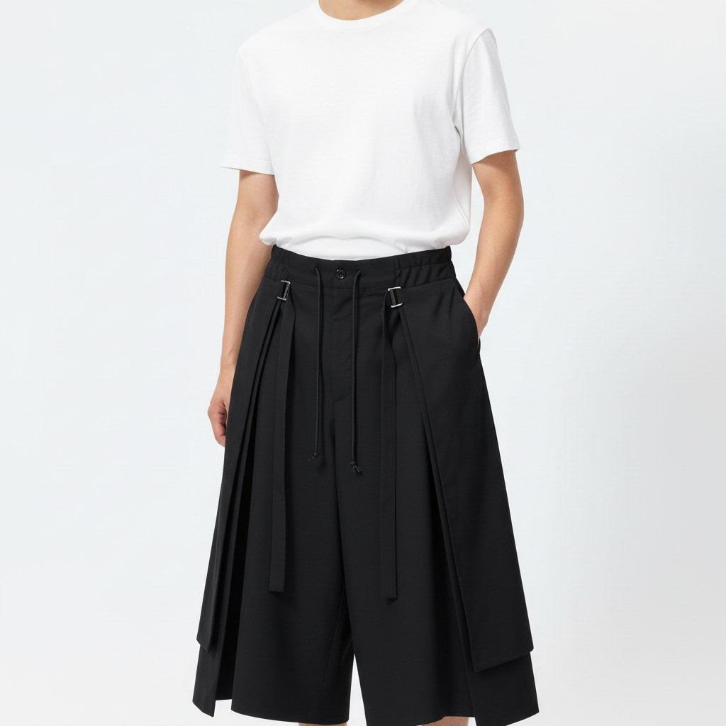 Strapped layered skirt pants on model, detail view of the fabric and construction