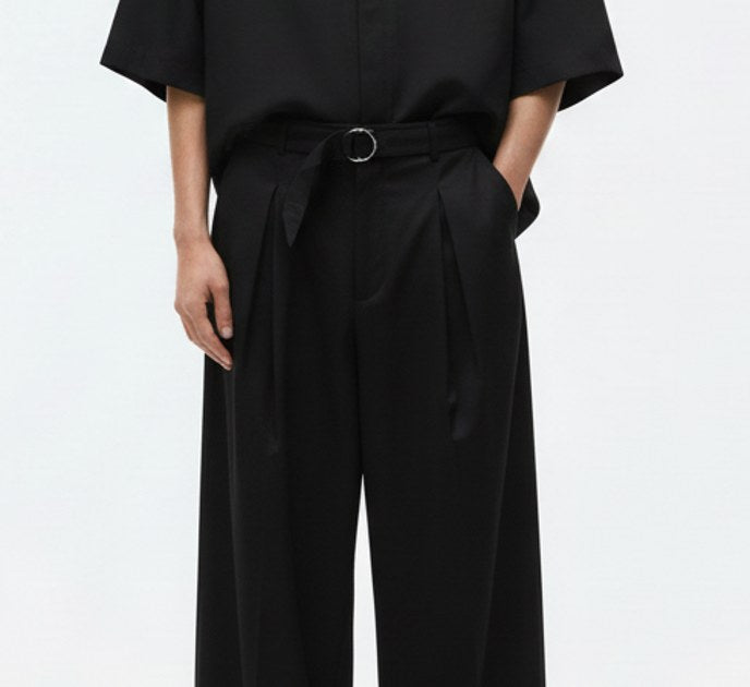Japanese wide leg pants with belt on model, detail view of the fabric and construction