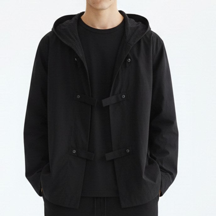 Hooded shirt jacket on model, detail view of the fabric and construction