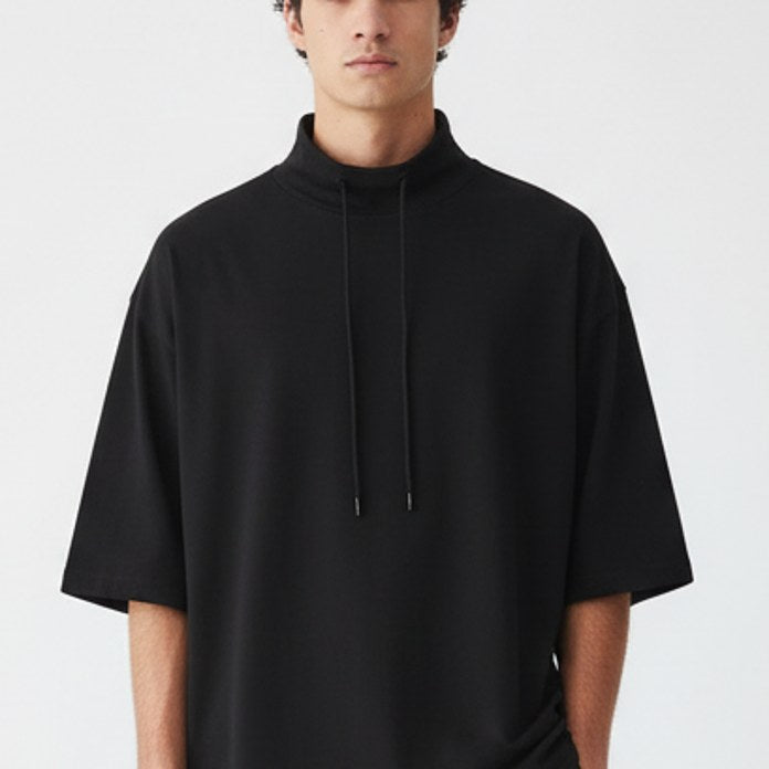 Lyocell mock neck tee on model, detail view of the fabric and construction