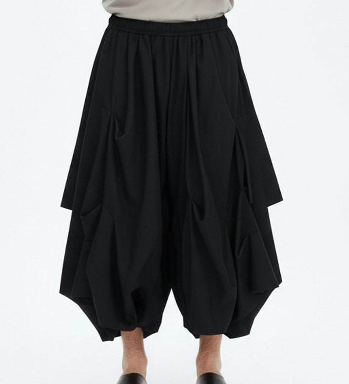 Bubble drape pants on model, detail view of the fabric and construction