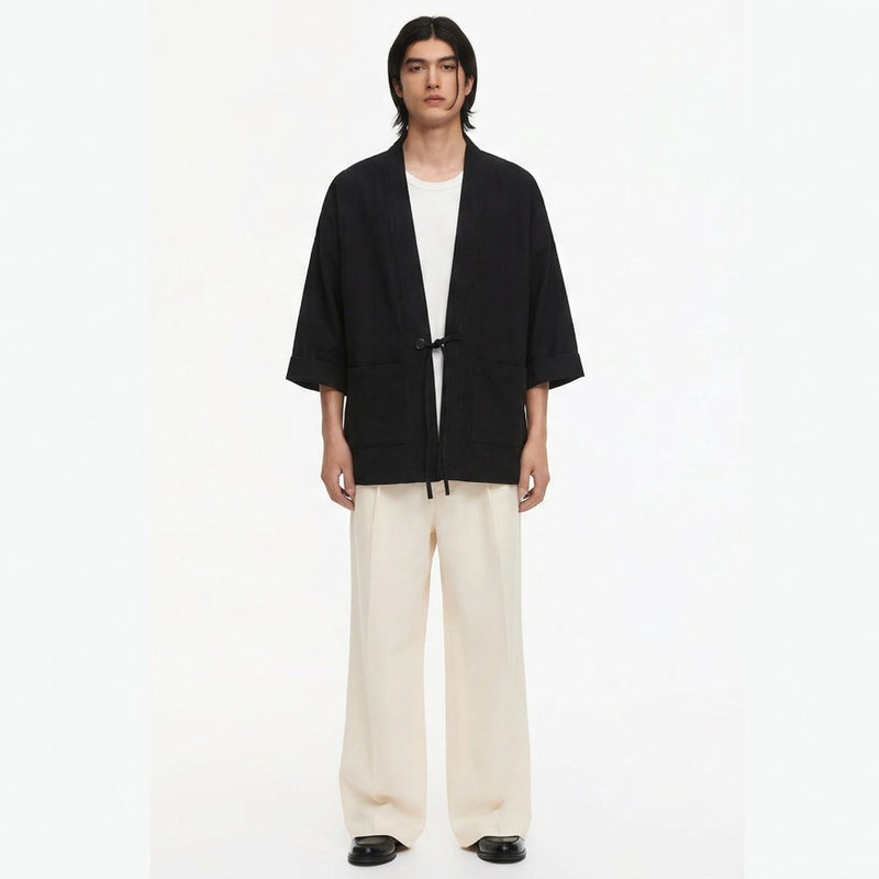 Tied noragi jacket in black, front view on model