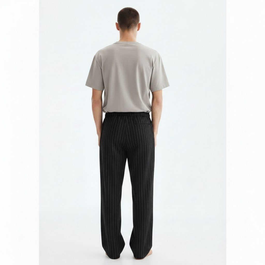 Textured striped trousers on model in black, back view