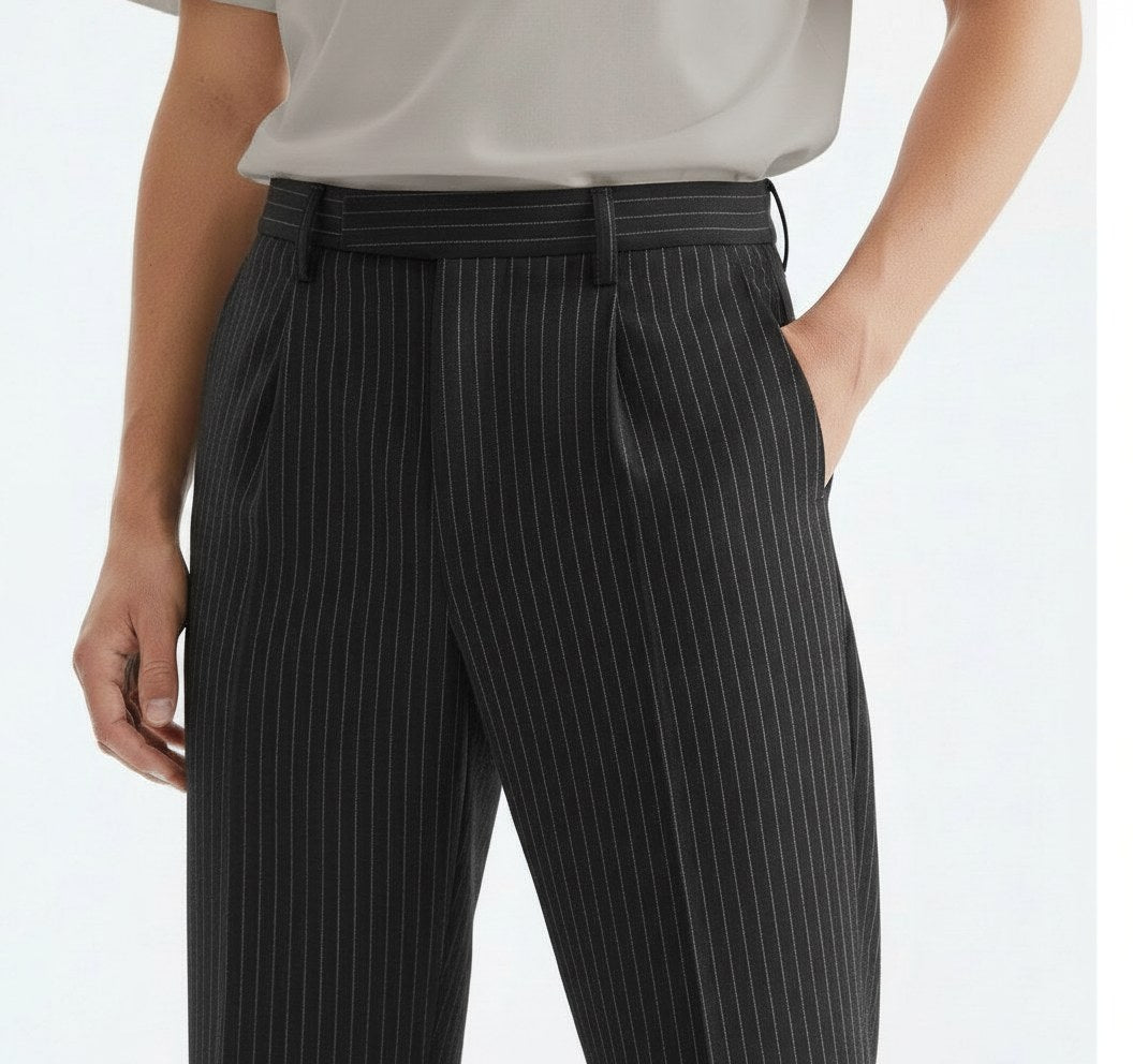 Textured striped trousers on model, detail view of the pinstripe and pleats