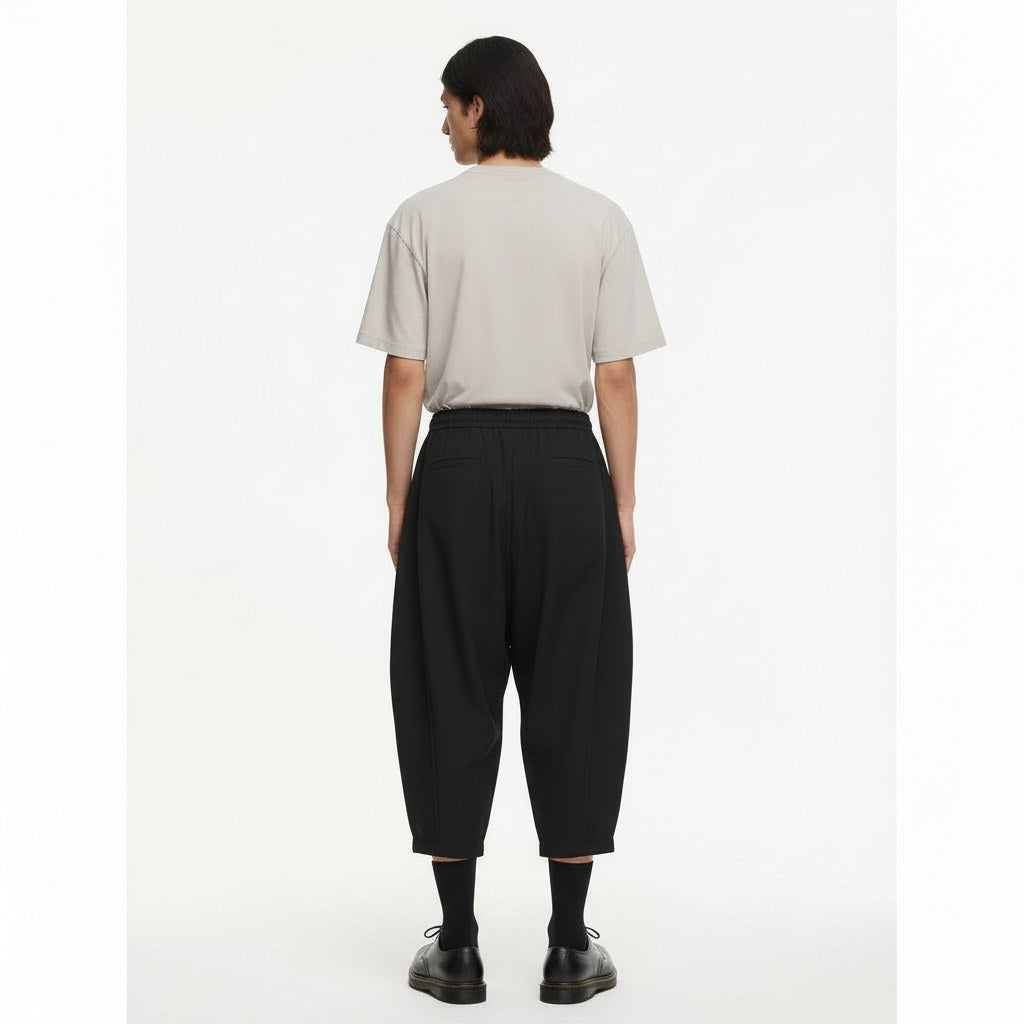 Balloon leg tobi trousers on model in black, back view