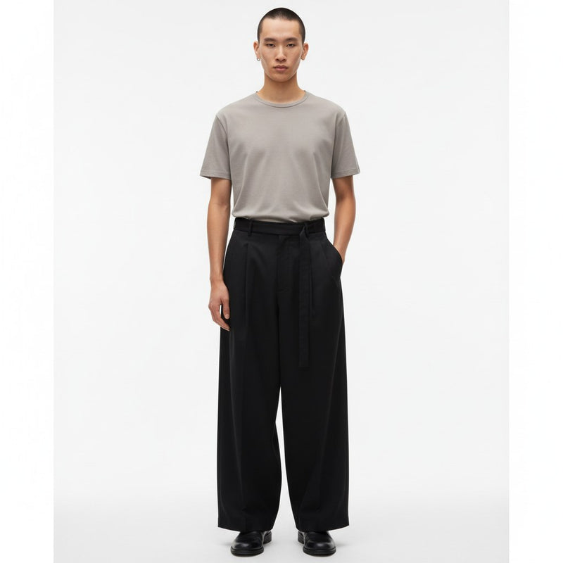 High waisted wide leg balloon pants for men in black, front view on model