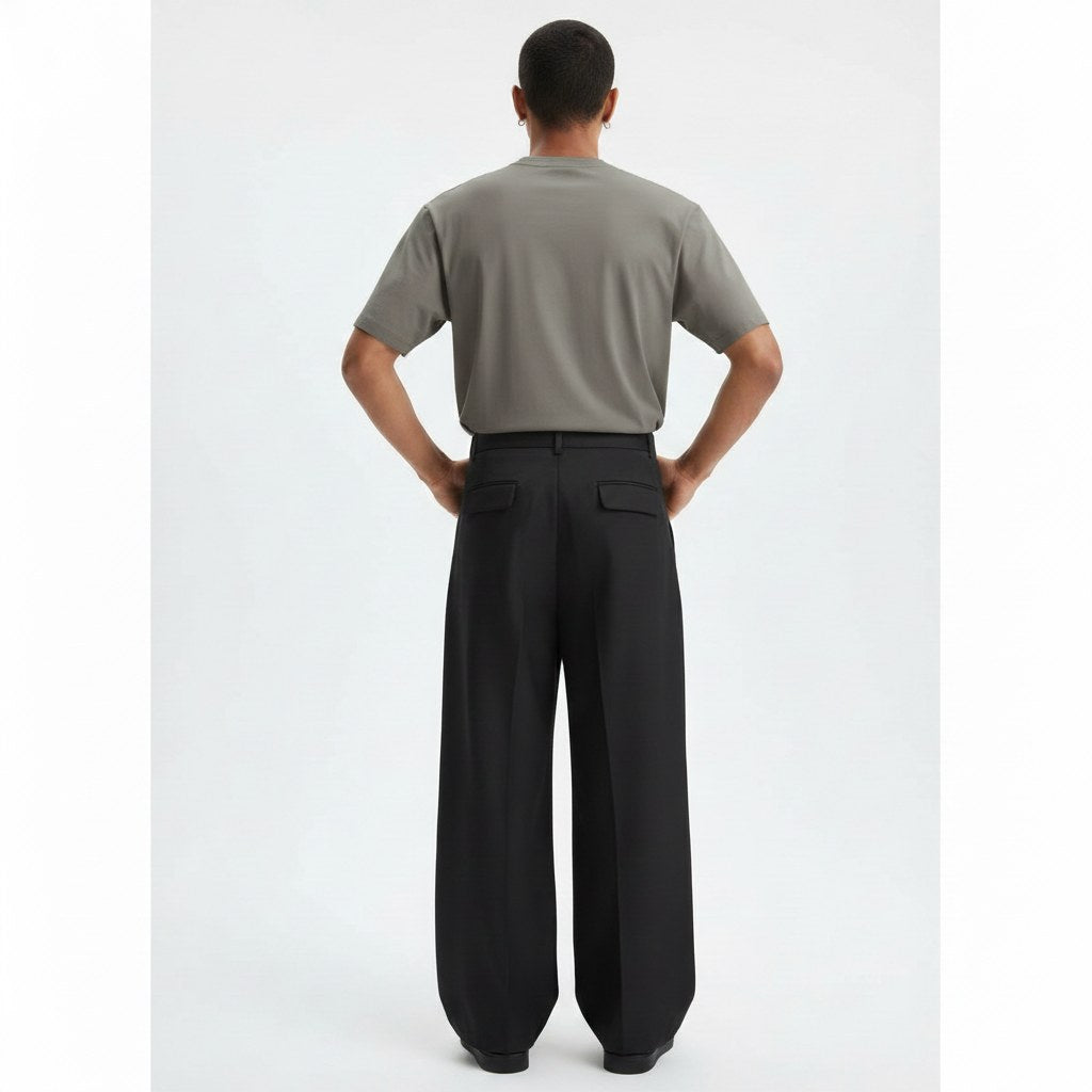 Wide pleated pants on model in black, back view